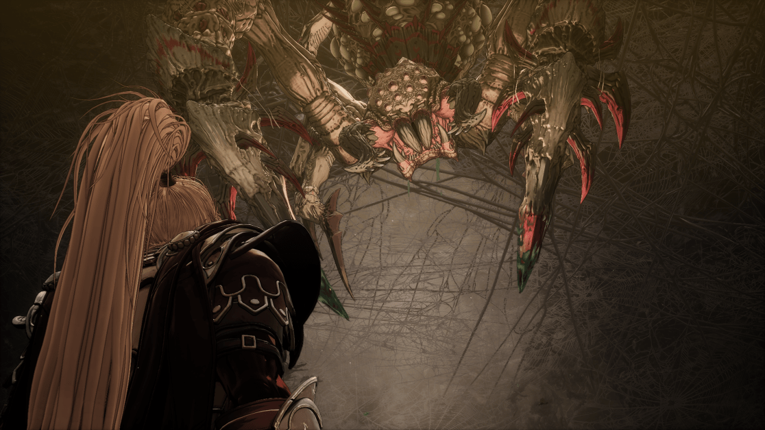 A warrior with long blond hair stands, back to the viewer, facing a massive, grotesque spider in a dark cavern. The spider, suspended above, has a cluster of eyes, large fangs and claws. Webs cover the dimly lit cavern walls. The scene suggests a tense, dangerous encounter.