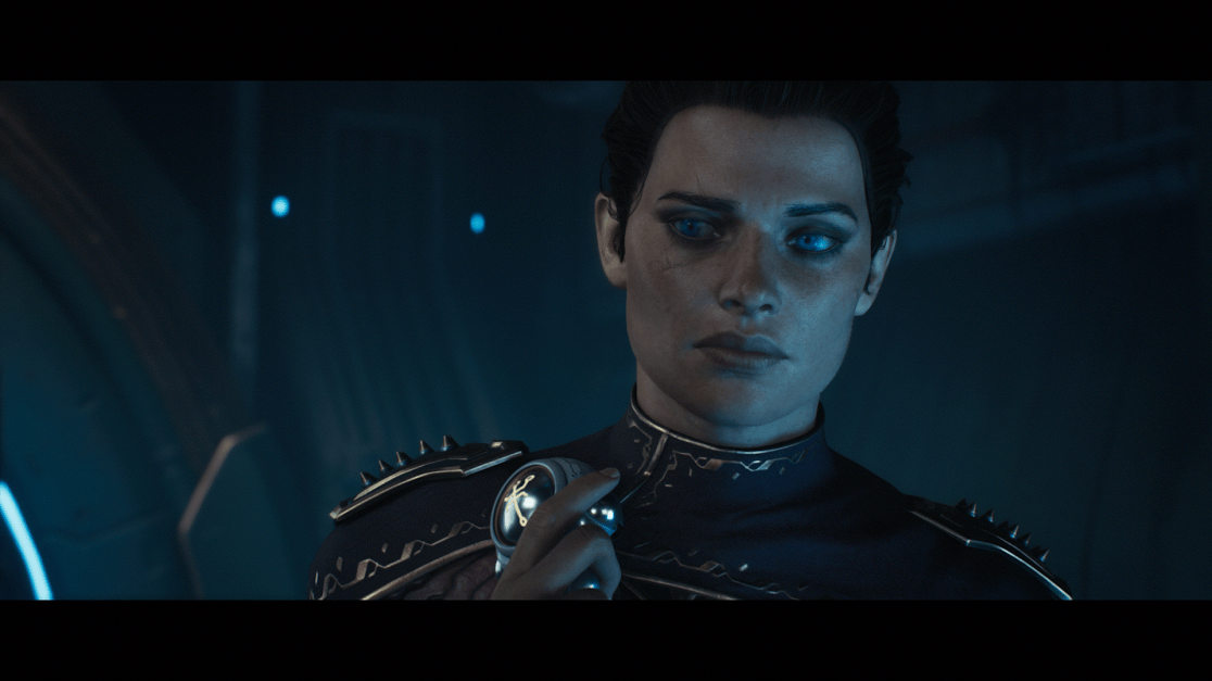The image features a woman with short, dark hair and vivid blue eyes in a futuristic setting. She wears an ornate, dark blue military uniform with gold trim and spiked epaulettes. Her expression is serious, conveying a sense of authority and determination. Close inspection reveals a scar near her left eye and a ring on her finger. The background is a blur of dark blues and hints of light, indicating a high-tech or space station environment.